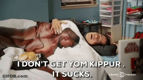 Man Laying On Bed With Woman Says I Don't Get Yom Kippur It Sucks GIF