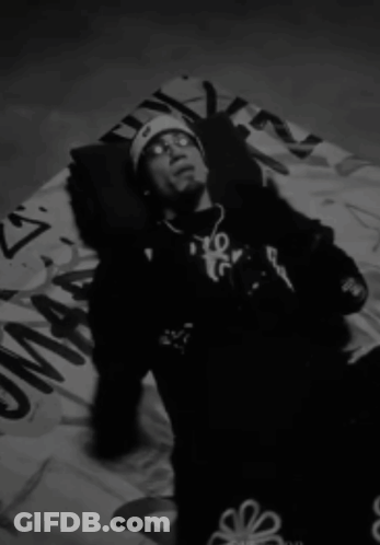 Man Laying On Blanket With Flower On Pants GIF