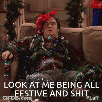 Man Laying On Couch Covered In Christmas Decorations Look At Me Being All Festive And Shit #Laff GIF