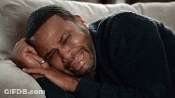 Man Laying On Couch Crying Eyes Closed GIF
