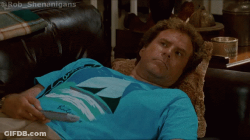 Man Laying On Couch Holding Remote In Budweiser Shirt GIF