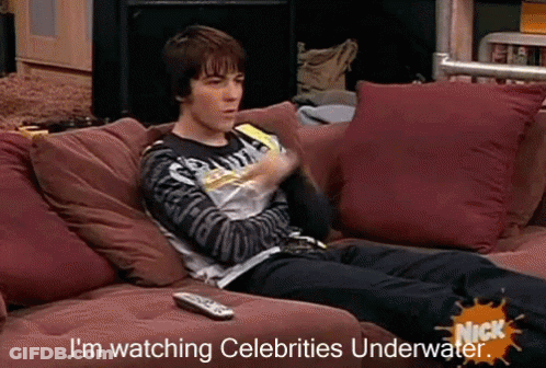 Man Laying On Couch Watching Celebrities Underwater GIF