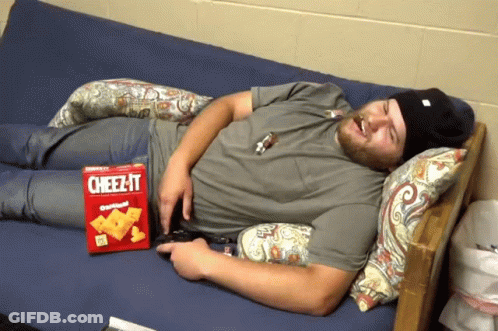 Man Laying On Couch With Cheez-It Box GIF