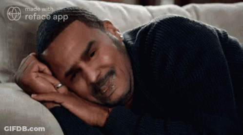Man Laying On Couch With Eyes Closed And Reface App Logo GIF