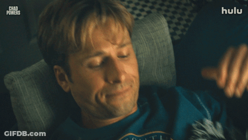 Man Laying On Couch With Hands Behind Head Chad Powers GIF