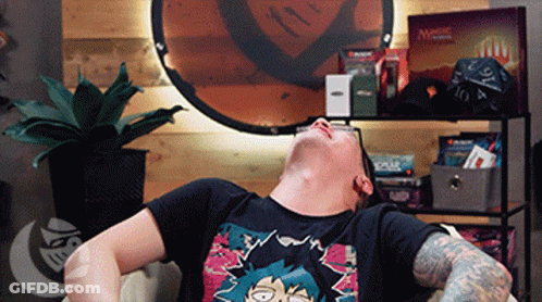 Man Laying On Couch With Magic The Gathering Cards GIF