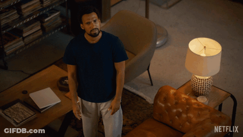 Man Laying On Couch With Netflix Logo GIF