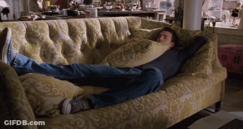Man Laying On Couch With Pillow On Head GIF