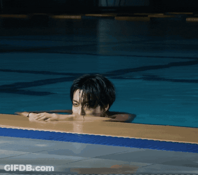 Man Laying On Edge Of Pool GIF