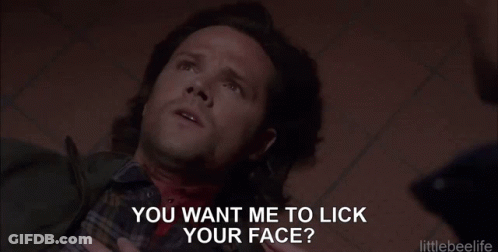 Man Laying On Floor With Blood Coming Out Of Neck While Another Man Holds His Hand Around His Neck GIF