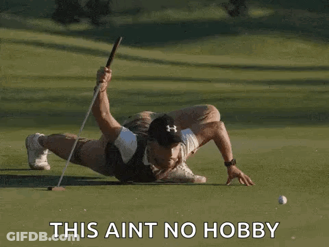 Man Laying On Golf Course Holding Club And Ball GIF