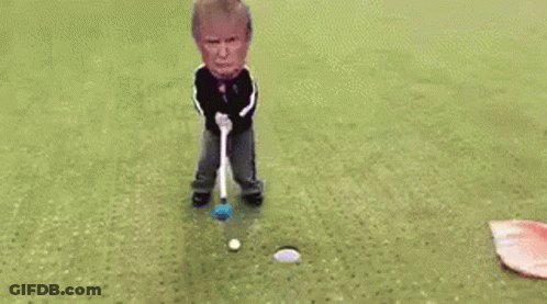Man Laying On Golf Course With Flag And Club GIF