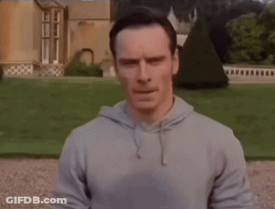 Man Laying On Ground Before Large House GIF