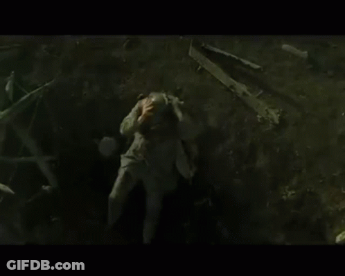 Man Laying On Ground In Dark Area GIF