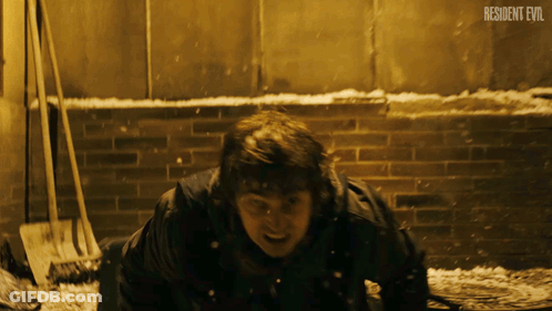 Man Laying On Ground Resident Evil GIF