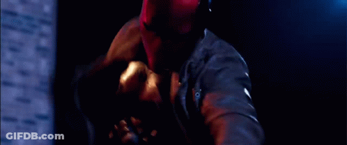 Man Laying On Ground With Knife GIF