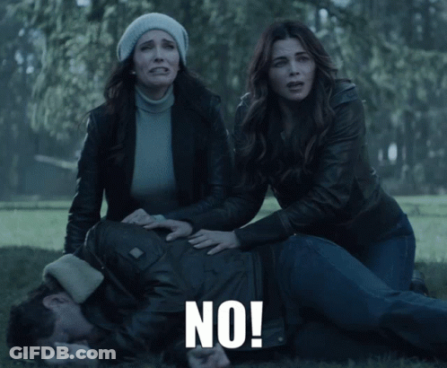 Man Laying On Ground With Two Women Screaming No GIF