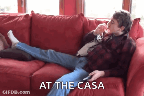 Man Laying On Red Couch At The Casa GIF