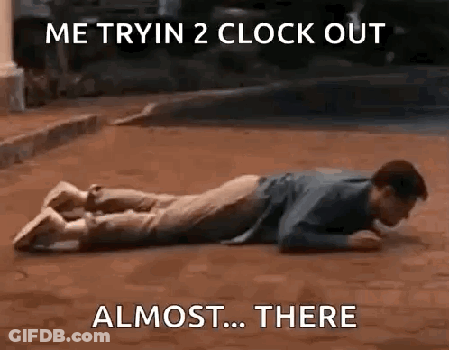 Man Laying On Stomach With Clock Behind GIF