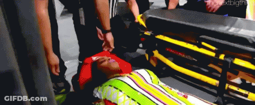 Man Laying On Stretcher With Blanket On Head GIF