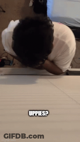 Man Laying On Table Saying Uppes GIF