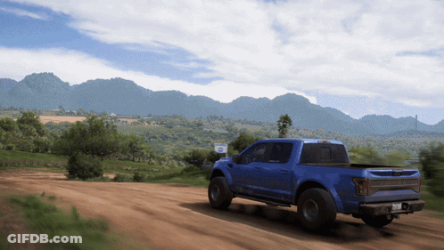 Man Laying On Truck Hood In Woods GIF