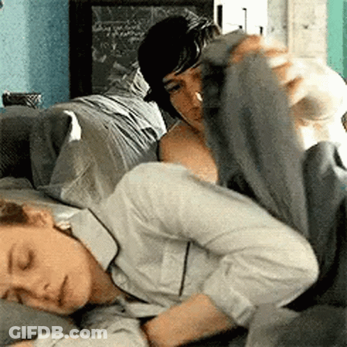 Man Laying On Woman's Lap On Couch GIF
