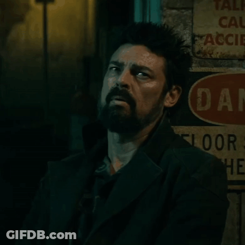 Man Leaning Against Danger Sign GIF