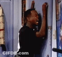 Man Leaning Against Door With Arms Up GIF
