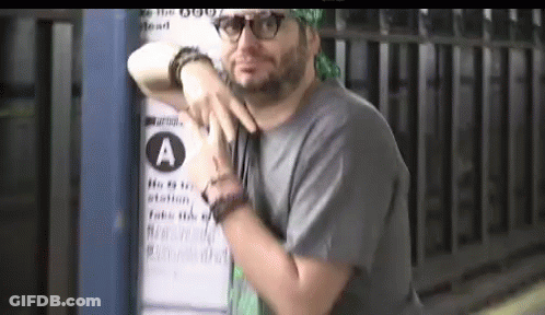 Man Leaning Against Sign Saying A GIF
