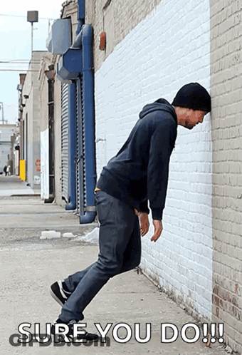Man Leaning Against Wall Saying Sure You Do GIF