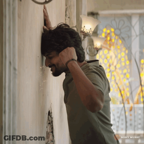 Man Leaning Against Wall Sony Music GIF