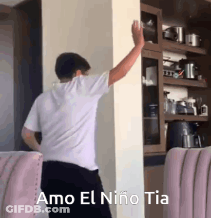 Man Leaning Against Wall With Arm Outstretched GIF