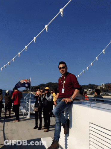Man Leaning On Railing With Australian Flag GIF