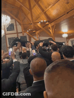 Man Lifted In Air By Group Of People GIF