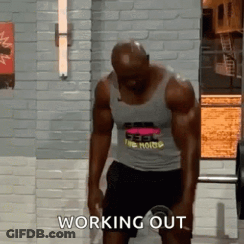 Man Lifting Barbell In Gym With Tank Top And Shorts GIF
