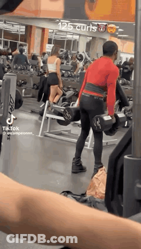 Man Lifting Dumbbell In Gym GIF