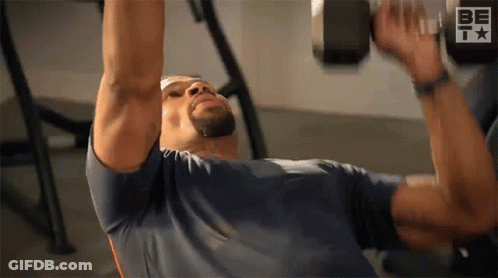 Man Lifting Dumbbell On Bench GIF