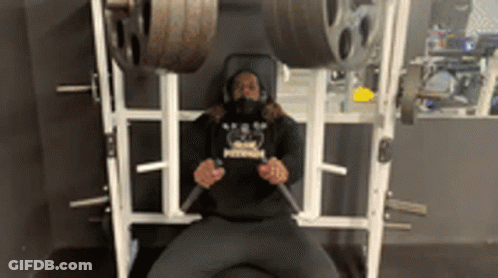 Man Lifting Dumbbells Overhead Level 2 DB OHP GIF