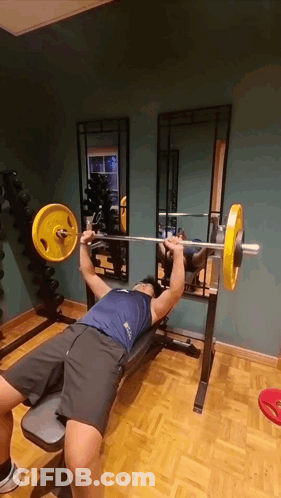 Man Lifting Yellow Barbell On Bench GIF