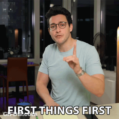Man Light Blue Shirt Glasses Saying First Things First GIF
