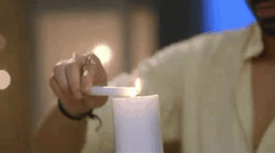 Man Lighting Bougie In A Date GIF