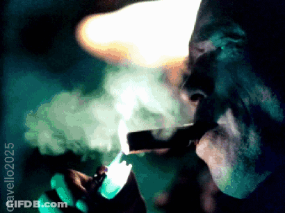 Man Lighting Cigar With Smoke GIF