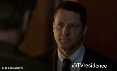 Man Looking At Another In Dark Room GIF