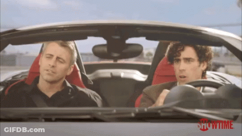 Man Looking At Camera In Crowd GIF