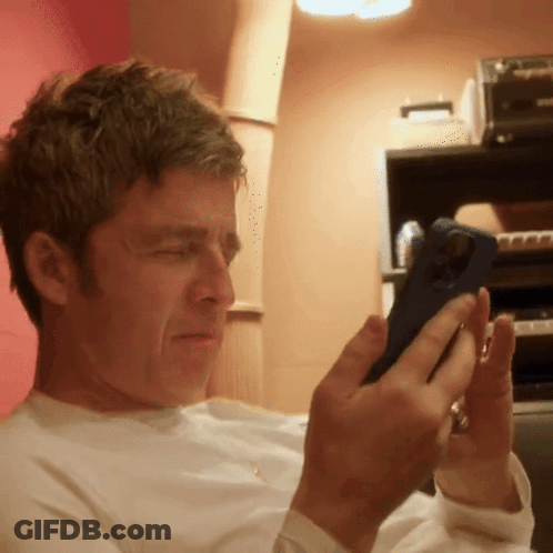 Man Looking At Cell Phone With Ring GIF