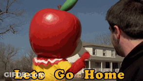 Man Looking At Giant Apple Mascot Saying Lets Go Home GIF