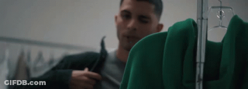 Man Looking At Green Jacket GIF