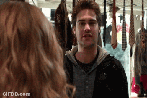 Man Looking At Himself In Mirror With Ties GIF
