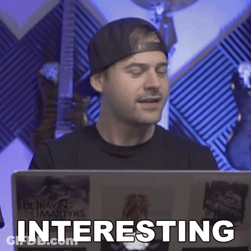 Man Looking At Laptop Saying Interesting GIF